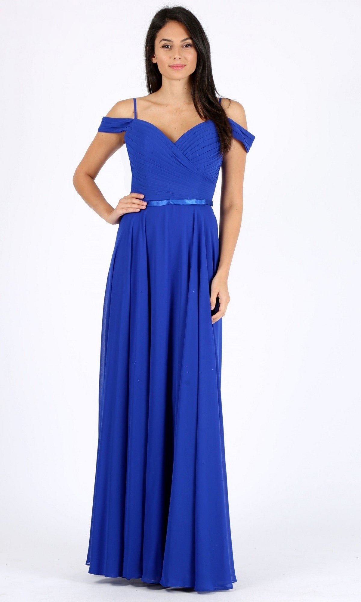 A woman poses in the Eureka 7611 long prom dress, featuring an off-the-shoulder chiffon design with a ruched fitted bodice and a flowing floor-length royal blue skirt, set against a plain white background.